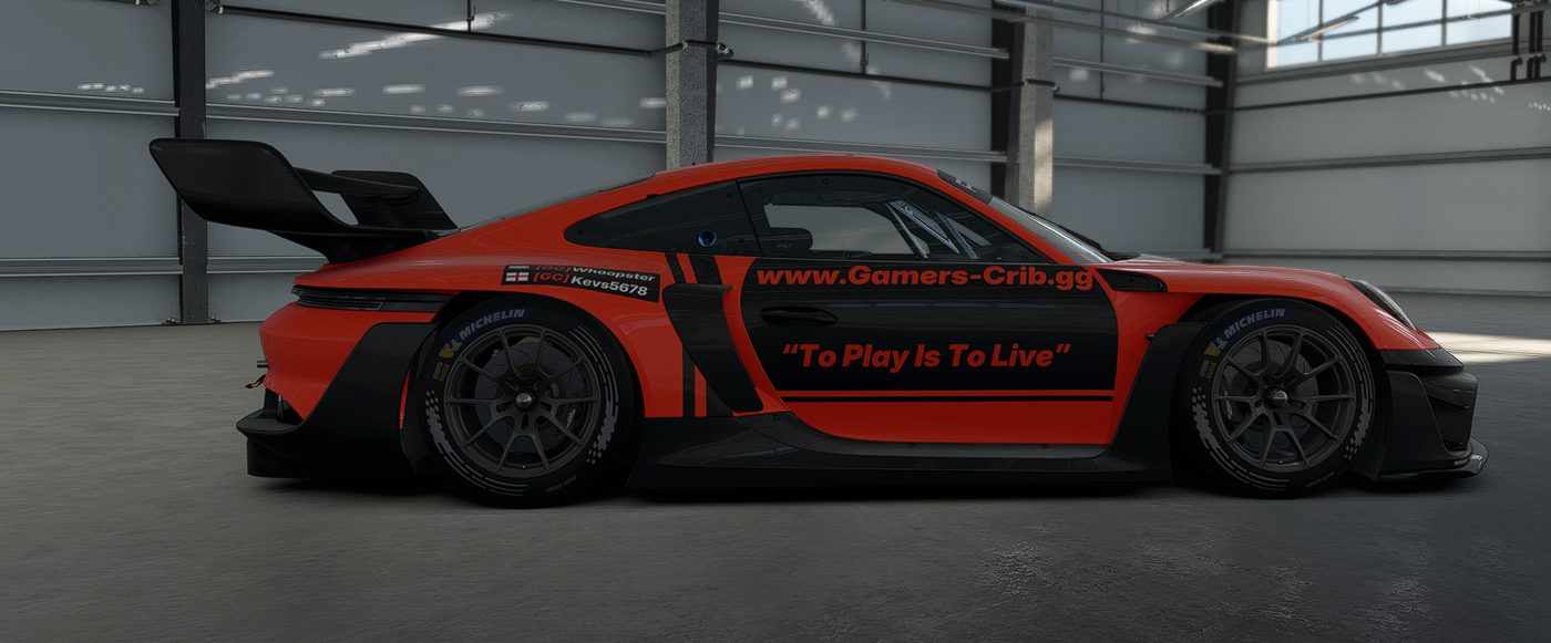 Porsche 911 GT3 R in the orange and black Gamers-Crib livery with the slogan To Play Is To Live